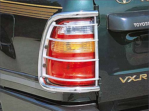 Toyota Land Cruiser J100/Lexus LX470 - Защитная решётка на задние фонари, нержавейка, полированная (модель - зад. дверь из 1-ой части) Нержавейка, полированная